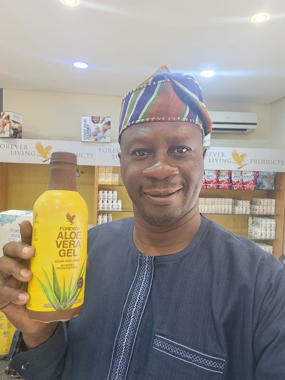 Mentor Olu drinking Forever Aloe Vera Gel